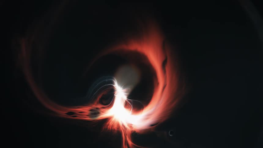An explosion sends out trails in a spiraling circle