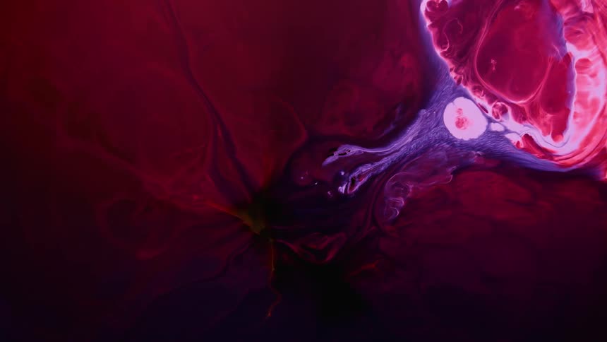 A purple substance expands into pink and white shapes