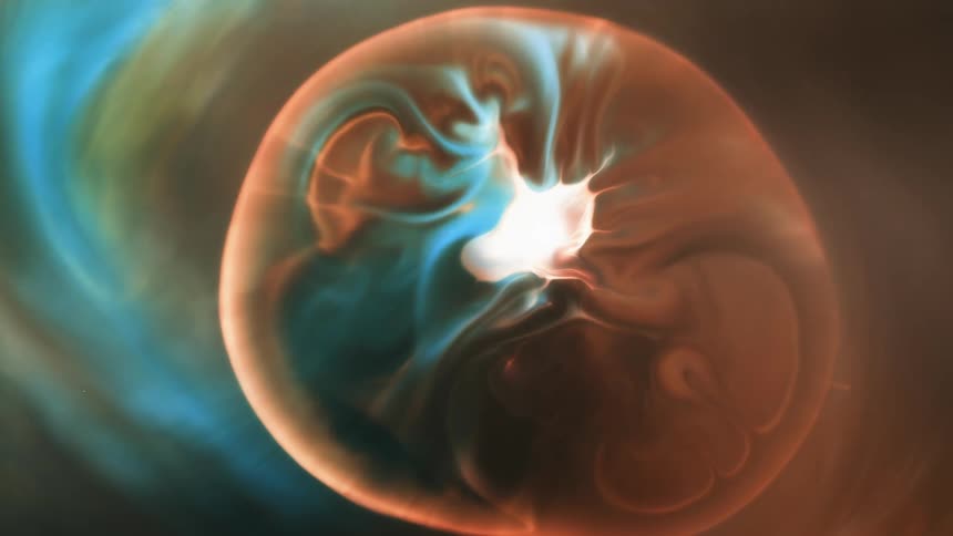 A liquid explodes and expands into many colors