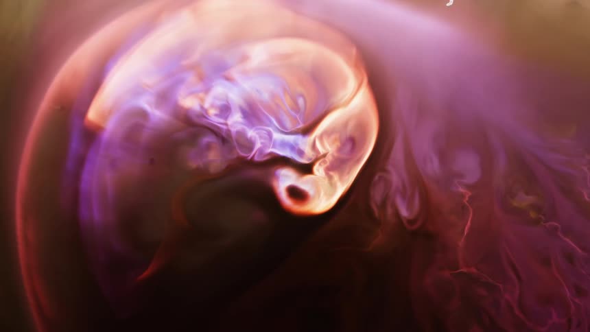 Colorful fluid rotates and expands into new patterns