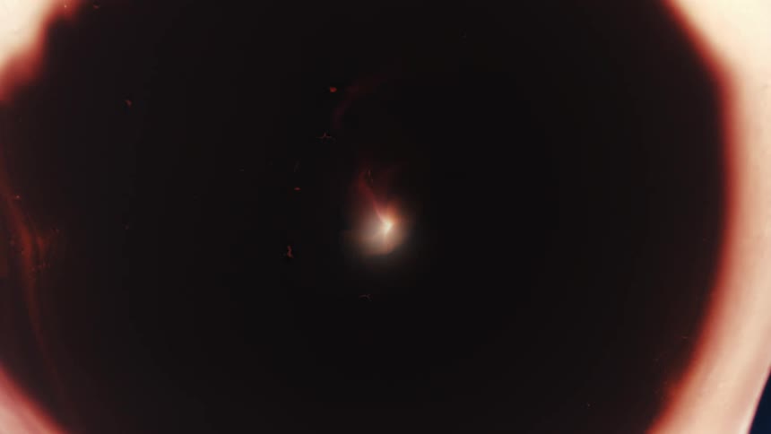 A flaming explosion sends a wave ring outward expanding leaving a center glow