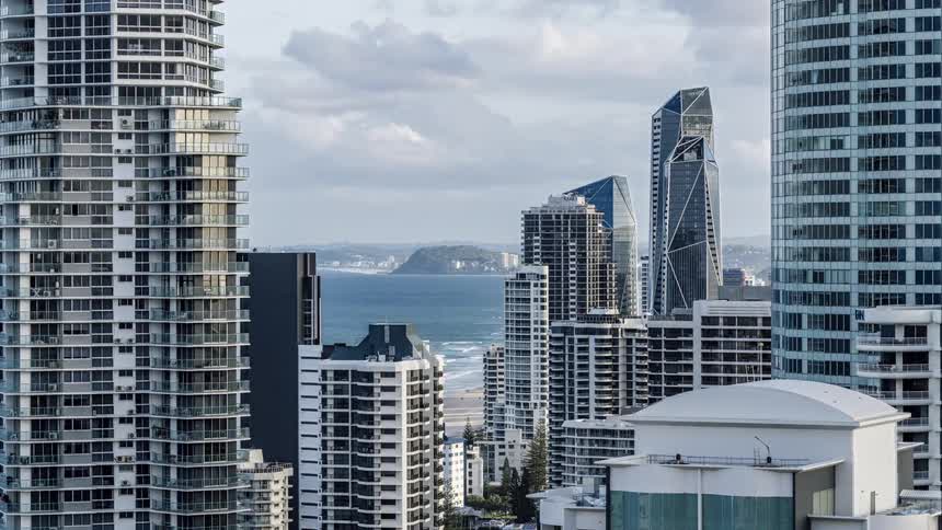 A time lapse of a coastal metropolis reveals numerous clouds passing overhead