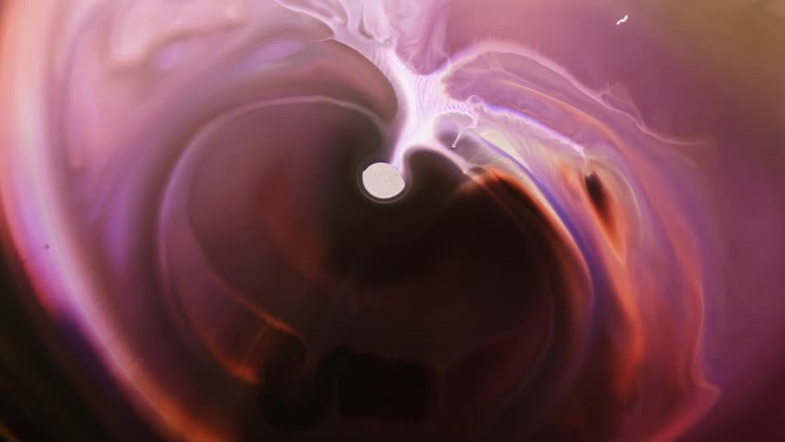 A ring and waves of color expand from a center circle