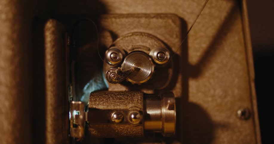 Film moves through a vintage film projector