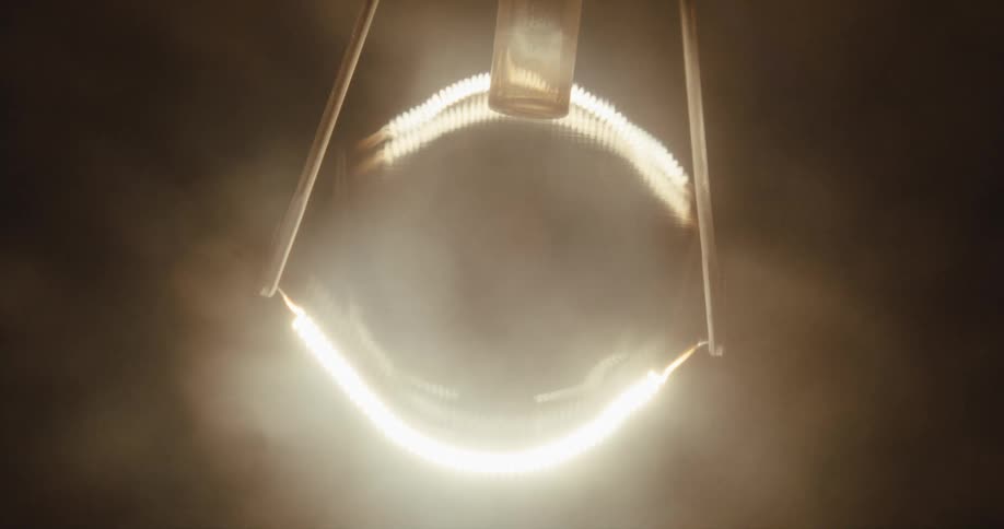 A light comes on glowing and creating foggy light before going dark