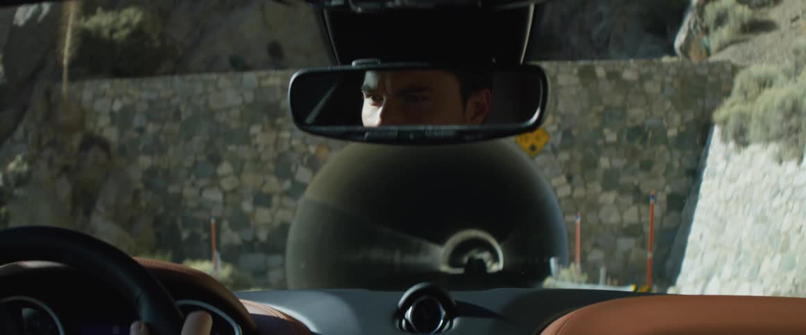 A person is driving a car through a tunnel