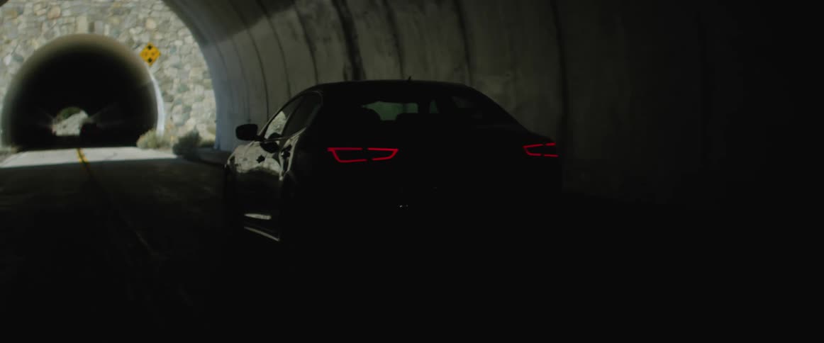 A view of a car driving through a tunnel