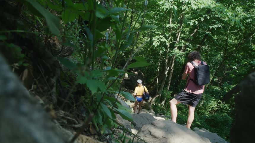 Two people are hiking down the mountain