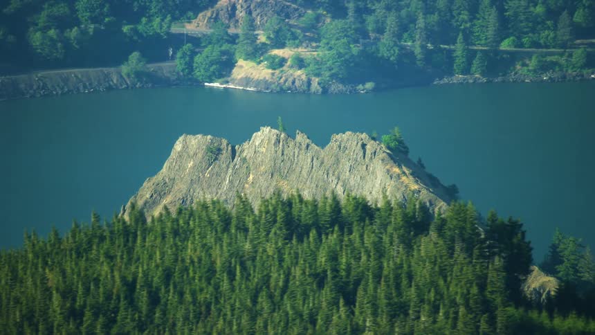 Mitchell Point aerial in the Columbia River Gorge with pine trees rapidly passing by in the foreground