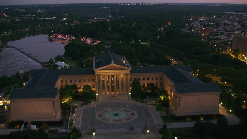 Aerial view of a city during sun set is displayed