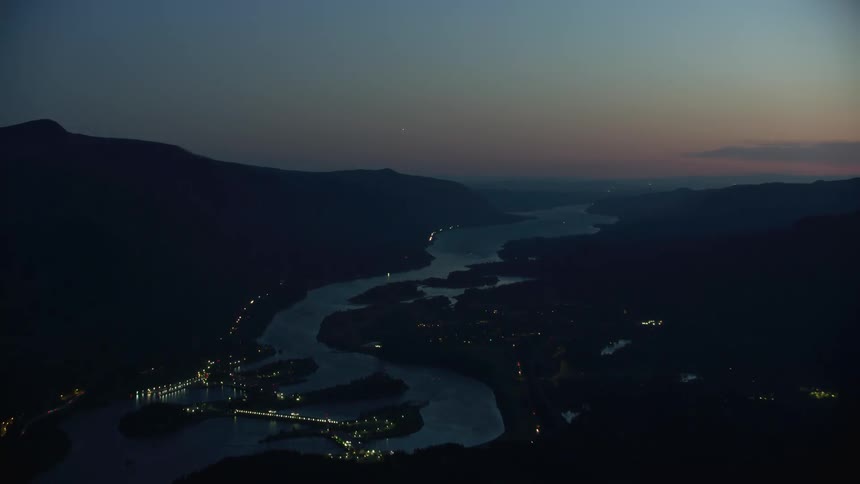 Blue hour aerial time lapse of the Columbia River and Columbia River Gorge in post sunset evening glow light