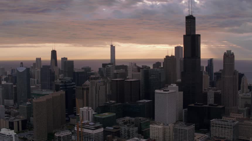 Aerial view of office buildings and skyscrapers at sunset in the city