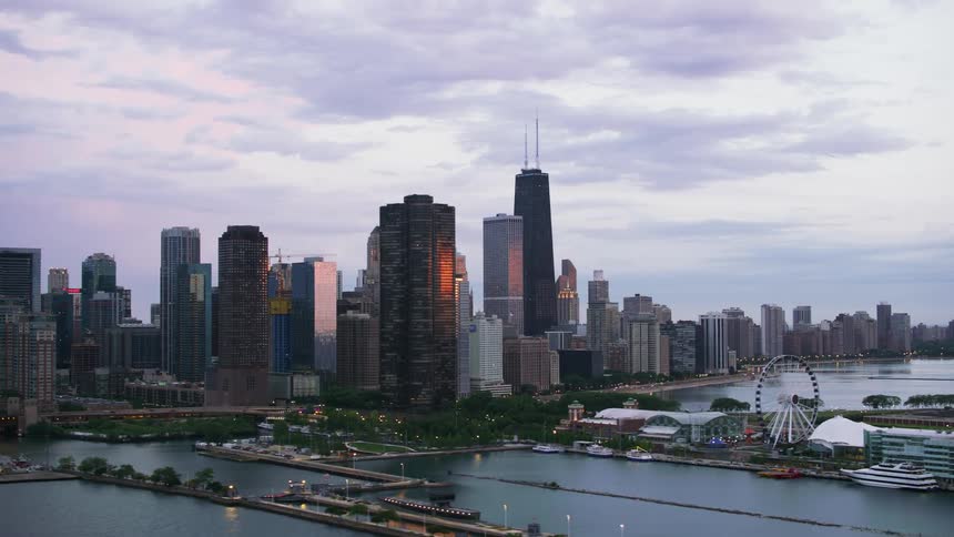 A ferris wheel is by the city