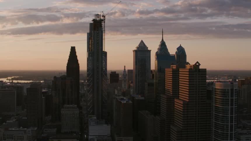 The sun is rising on the city