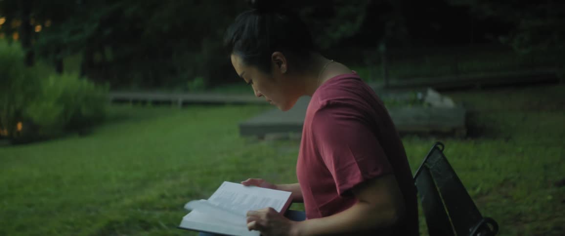 A woman is reading in the park