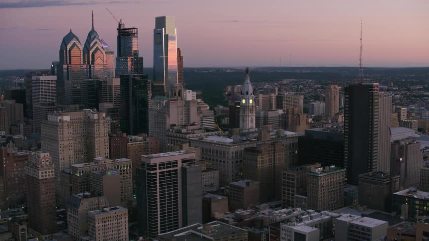 The sun is rising on the city