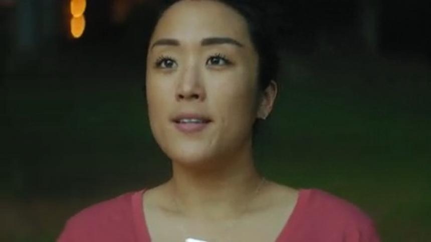 A peaceful calm woman breaths as she watches the sunrise