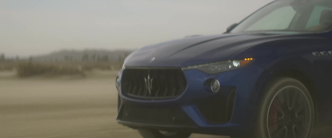 A car driving on a dirt road