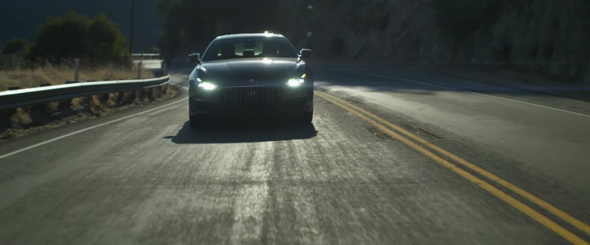 A car traveling on a windy mountain road