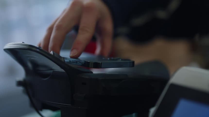 A person paying for something using a smartphone