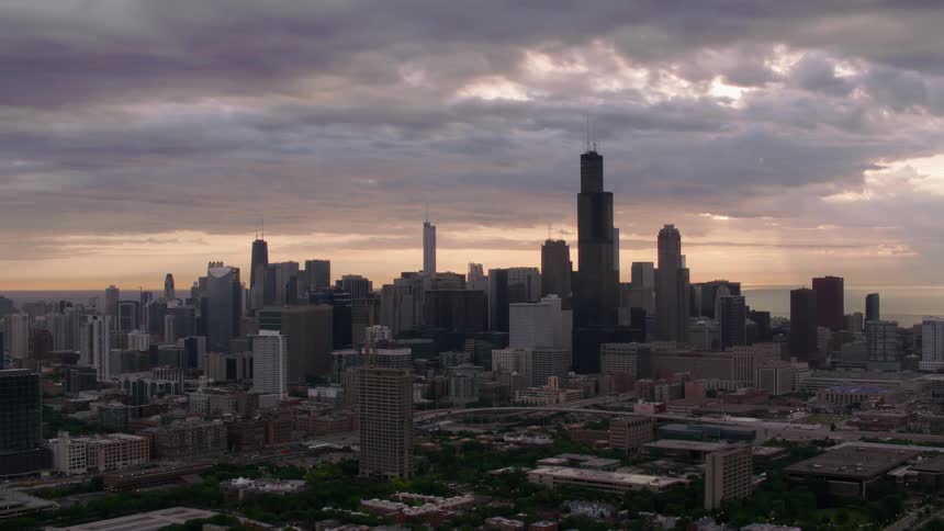Aerial view of a downtown city is displayed at dusk