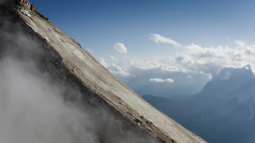 Steep slope on the mountain under a sunny blue sky
