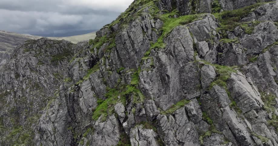 Moss grows between ridges on the sides of a steep canyon
