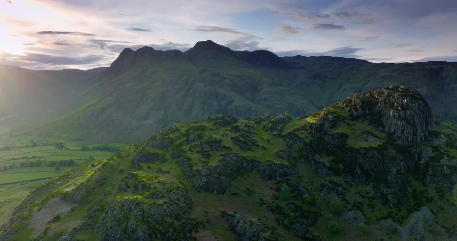Green rocky ridges over a lush valley