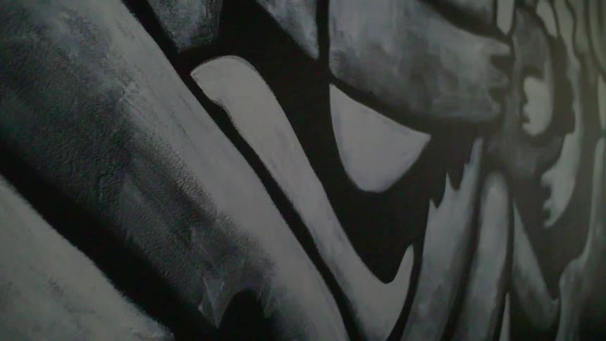 A wall has artwork painted on it