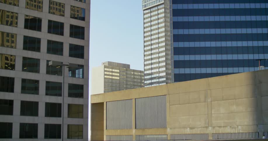 City high-rises standing against a blue sky