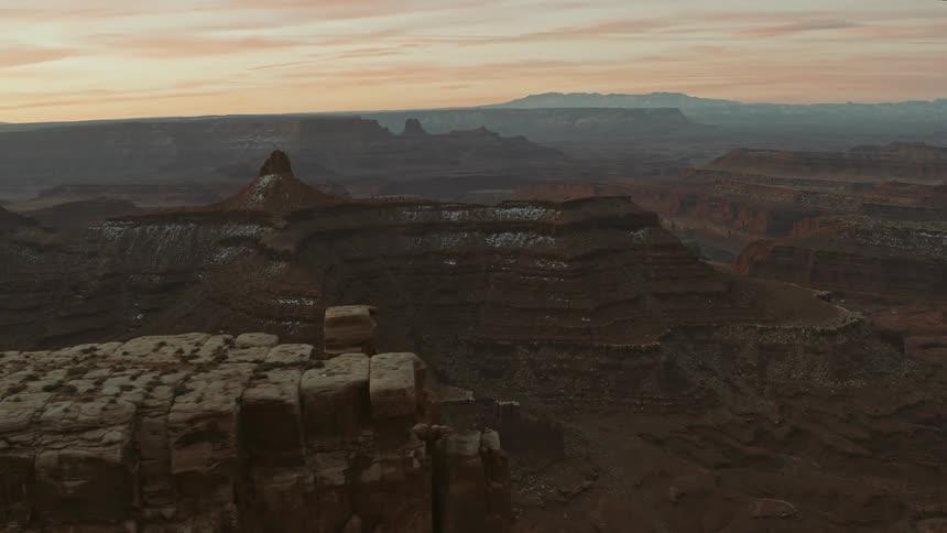 Aerial view of canyons and mesas in the desert at sunset