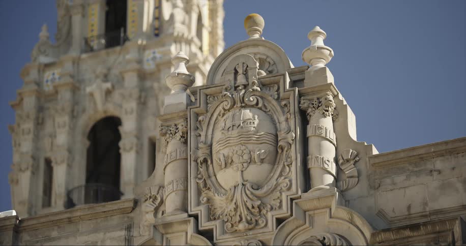 A detailed sculpture sits along the top of a building