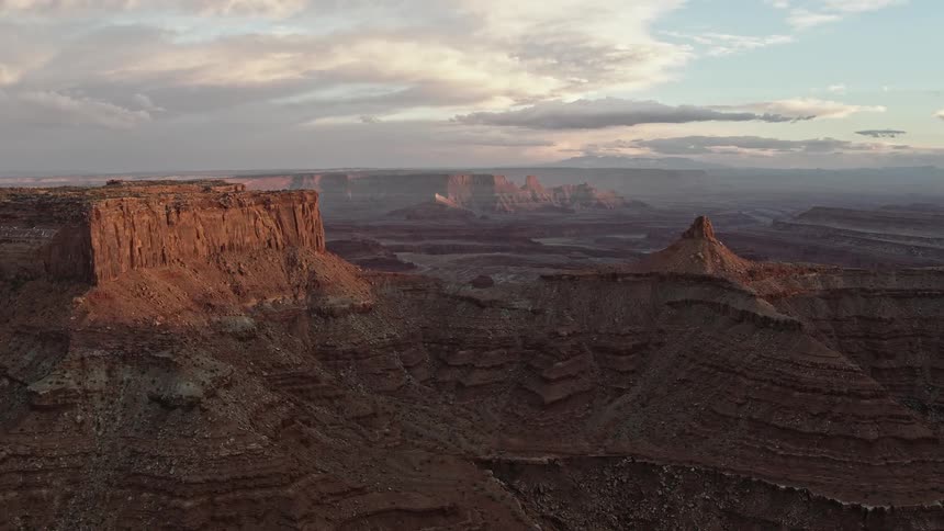 A vast canyon under a cloudy daytime sky