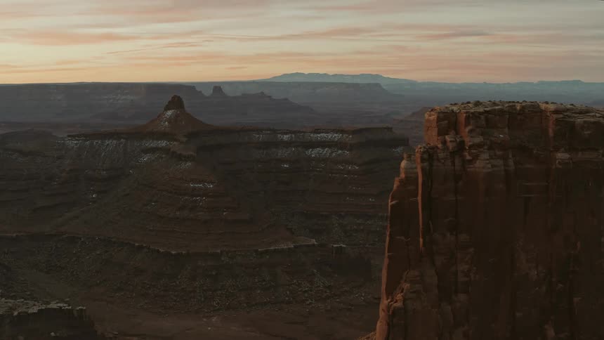 An aerial view of a canyon and the valley below