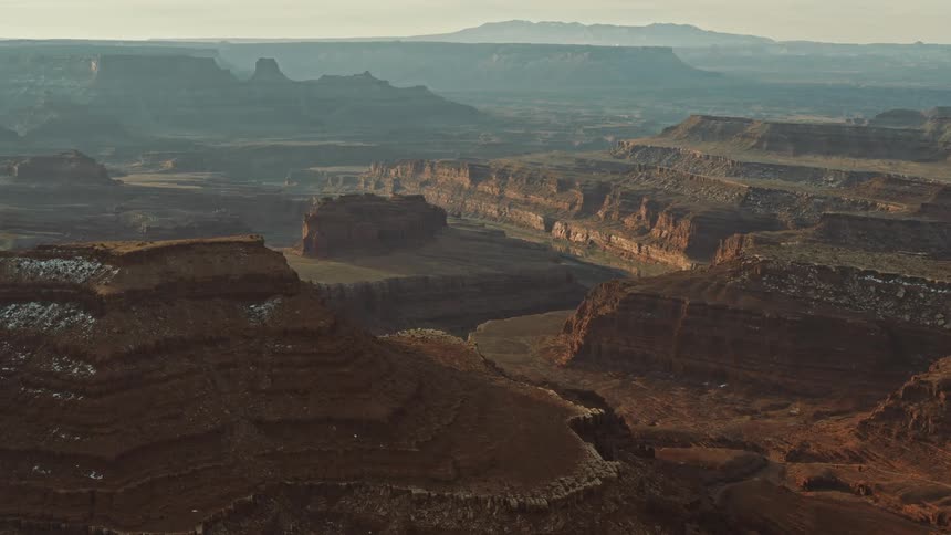 A vast canyon on a foggy day