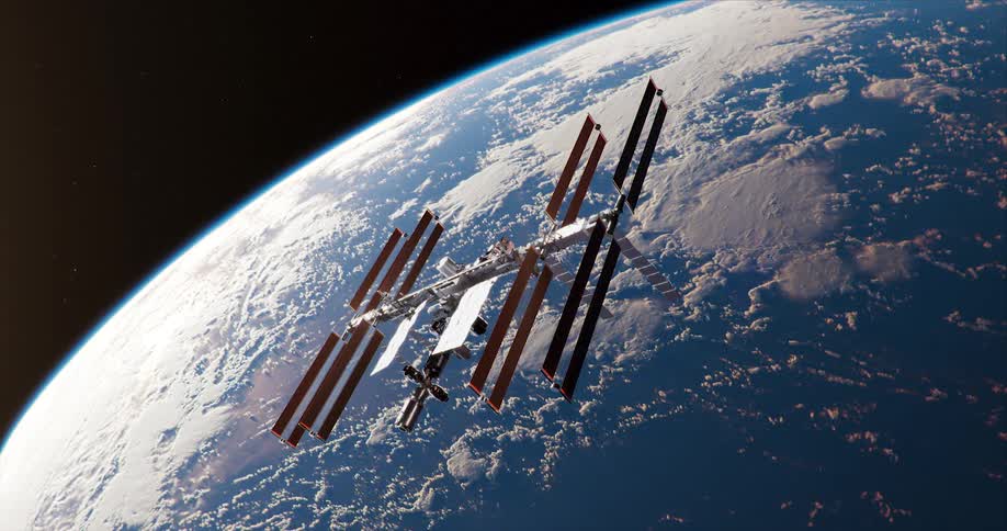 A space station is hovering over the planet earth as it orbits around it