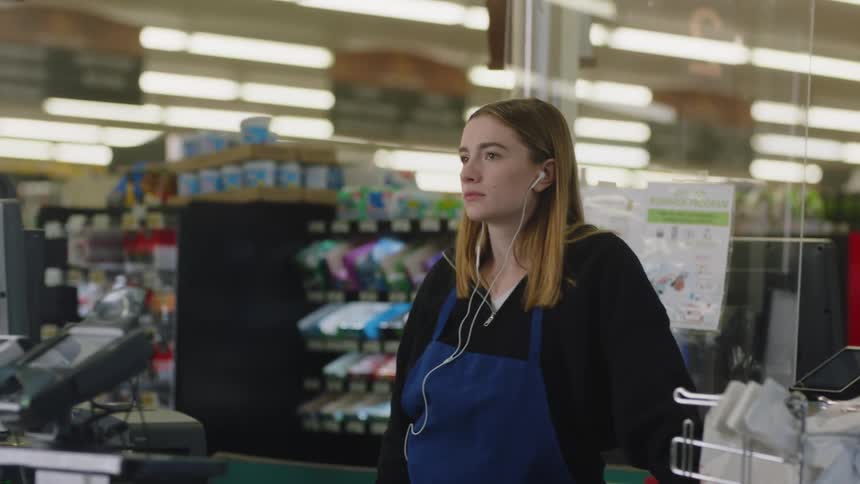 A woman working in a grocery store
