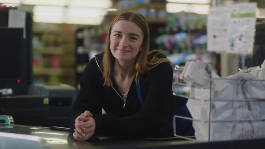A woman working at a grocery store