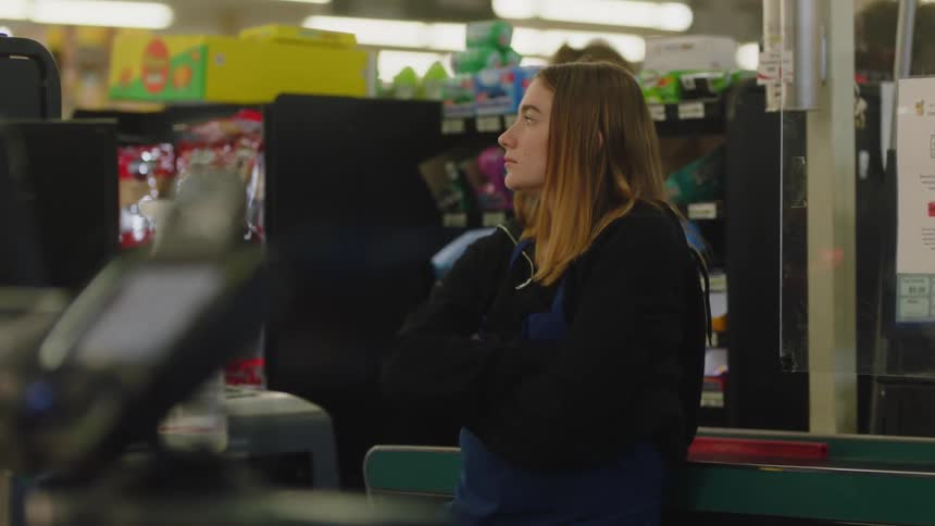 A woman working in a grocery store
