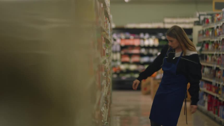 A woman working in a grocery store