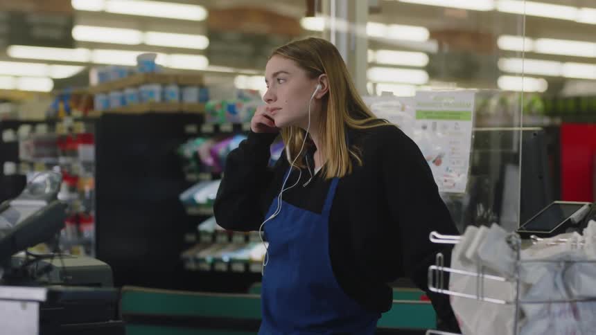 A woman working at a grocery store