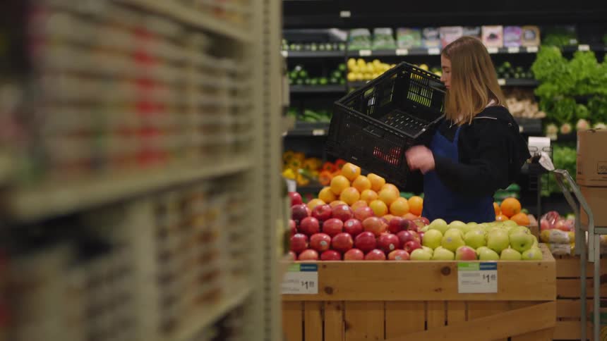 A woman working in a grocery store