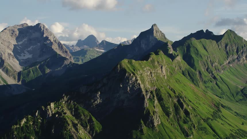 Aerial view of steep green mountain ranges