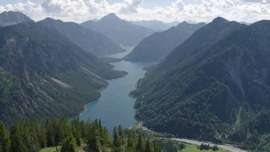 Aerial view of river between high mountains