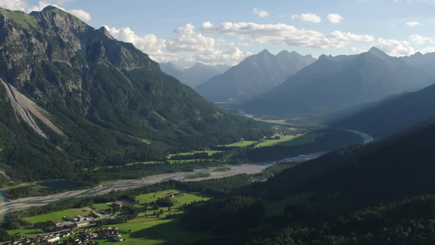 Aerial view of towns next to river in valley
