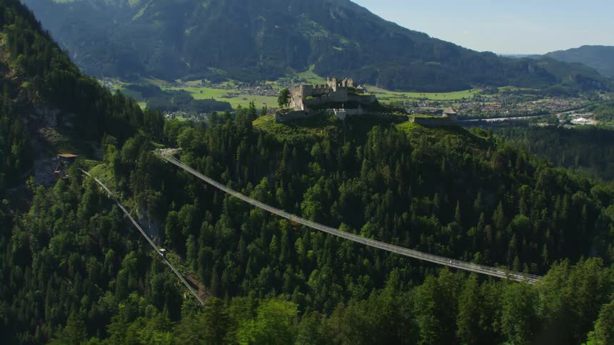Aerial view of fort Ehrenberg castle atop a mountain close to a the small town of Reutte