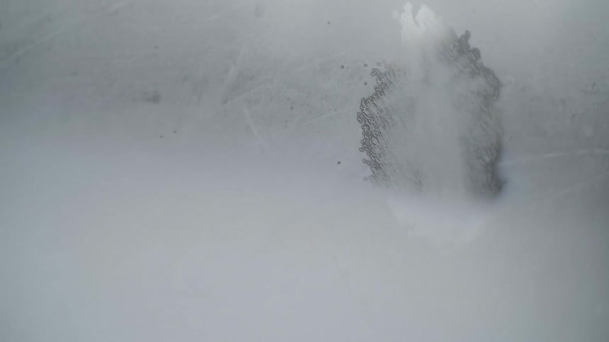 A frosted window shows snow outside