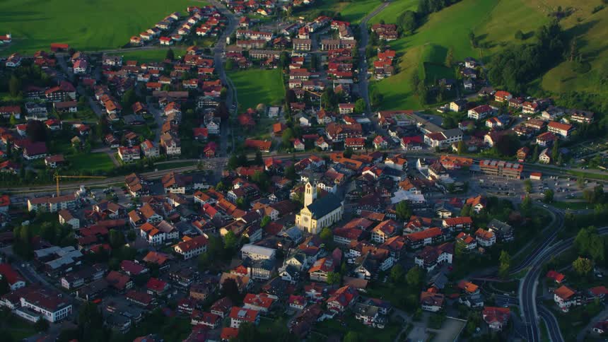 Aerial view of a church in the middle of a small town at morning