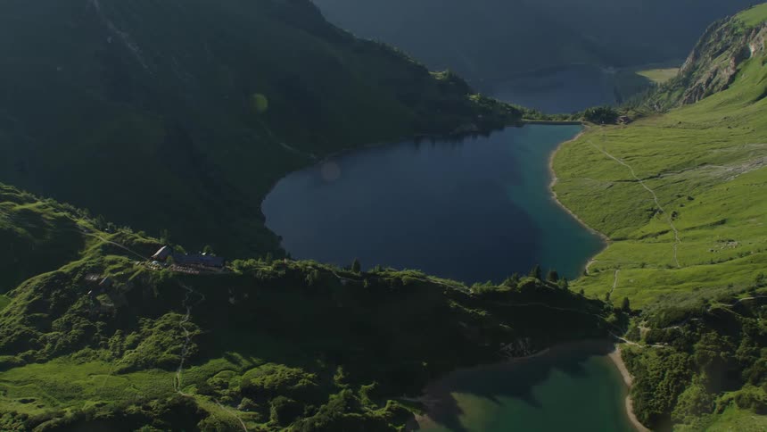 An aerial view of a river running between hills