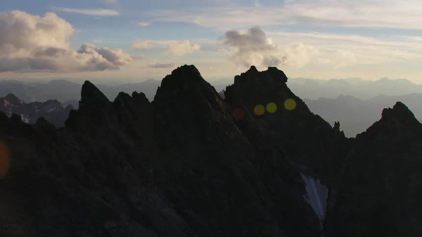 A rocky and jagged mountain range extends as far as the eye can see
